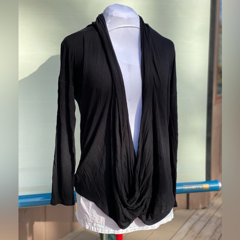 Lightweight black knit top. Shawl type collar. Twist front. Drop shoulder